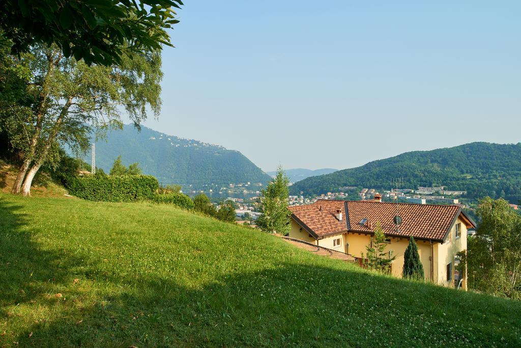 Comova Maslianico Bagian luar foto