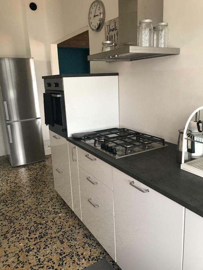 Comova Maslianico Bagian luar foto